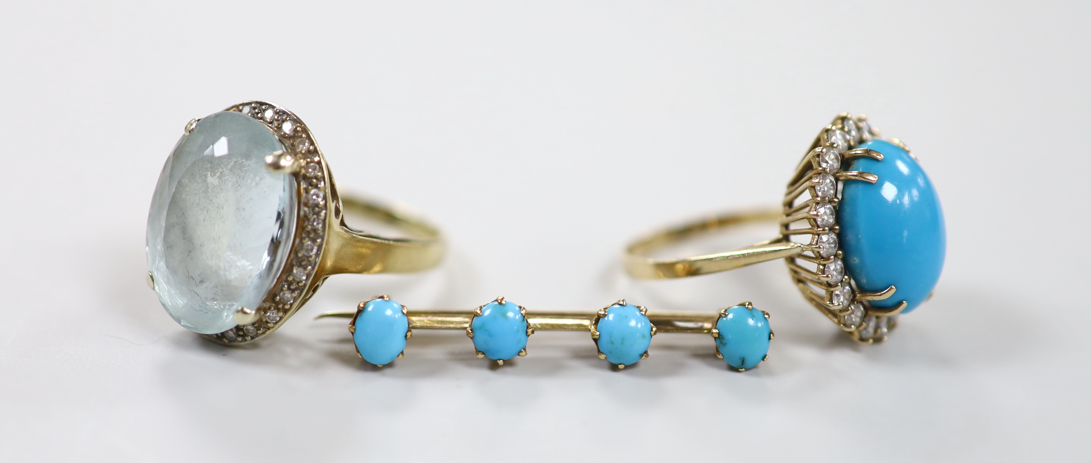 Two modern 9ct and gem set dress rings, including turquoise and simulated diamond set cluster and a yellow metal and four stone turquoise set bar brooch, gross weight 19.6 grams.